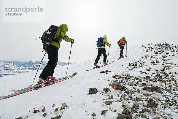 A group of skiers climb up a backcountry peak on Teton Pass in Jackson Hole  Wyoming.