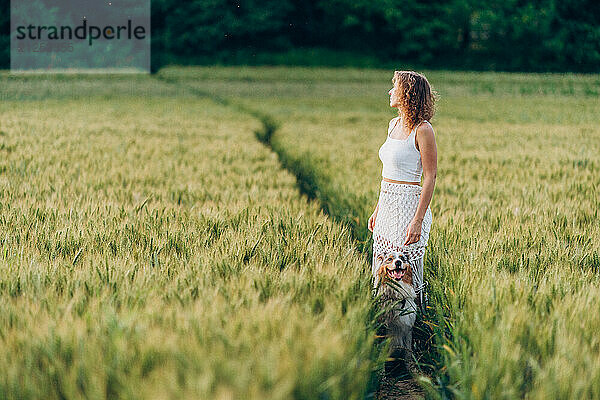 Young woman and her Australian Shepherd listening to the silence