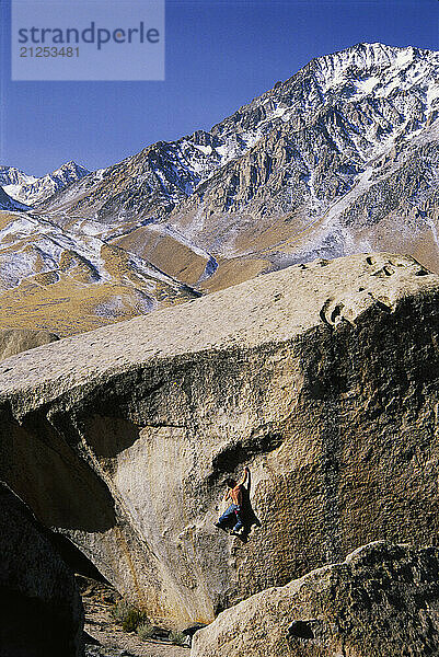 Kevin Jorgeson making the first ascent of Flight of the Bumble Bee a high V7 boulder problem near The Buttermilks  in the Eastern Sierra near Bishop  California