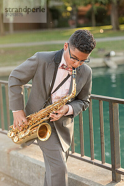 Young boy playing the saxophone