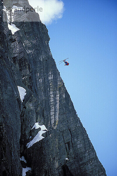 Miles Daisher pulling a front flip while ski-BASE jumping at Lover's Leap  near Lake Tahoe. Ski-BASEing is a hybrid of extreme skiing and BASE jumping in which one skis off a steep cliff with a parachute. There is little room for error. ( Jerry Dodrill / Aurora Photos )