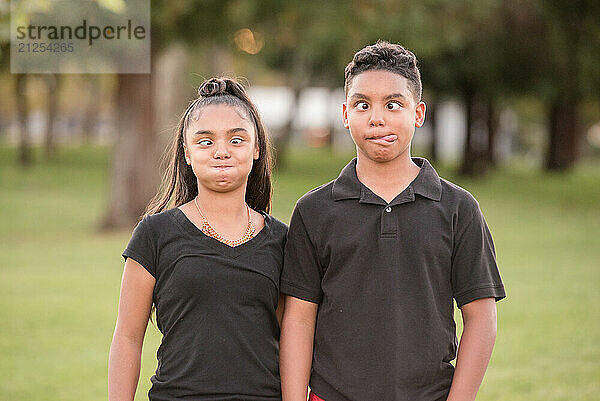 Brother and sister making silly faces