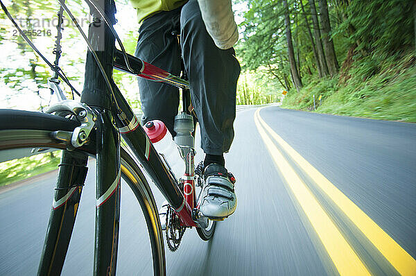 A cyclist trains on a rural highway near Portland  Oregon.