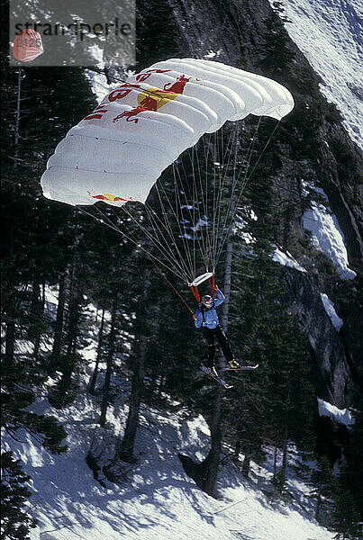 Karina Hollekim ski-BASE jumping at Lover's Leap  near Lake Tahoe. Ski-BASEing is a hybrid of extreme skiing and BASE jumping in which one skis off a steep cliff with a parachute. Karina  a professional athlete from Norway  is currently the only know female ski BASE jumper.