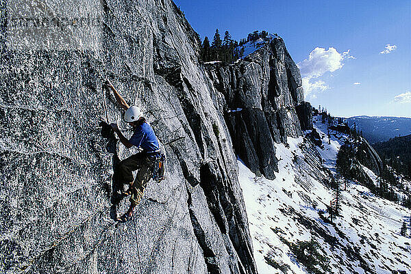 Kevin Jorgeson climbing Fantasia at Lover's Leap  a popular granite climbing destination near Lake Tahoe in California's Sierra Nevada mountains. The cliff is known for its distinct horizontal quartz dikes which make interesting climbing. This route is considered a risky mental test piece because of its lack of good cracks for protection. It was first climbed in 1973 by Royal Robbins and Ken Wilson.