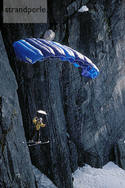 Max Kuszaj steering his parachute after ski-BASE jumping at Lover's Leap  near Lake Tahoe. Ski-BASEing is a hybrid of extreme skiing and BASE jumping in which one skis off a steep cliff with a parachute. There is little room for error.