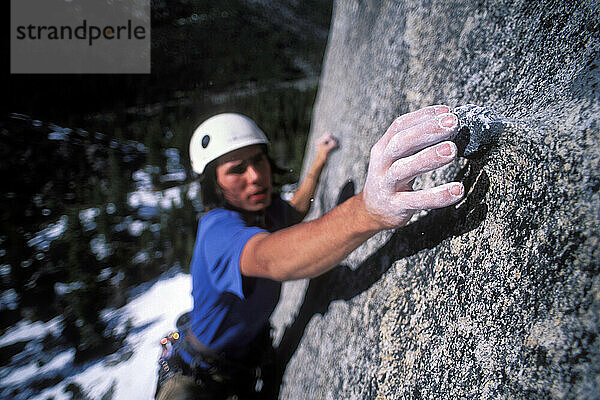 Kevin Jorgeson climbing Fantasia at Lover's Leap  a popular granite climbing destination near Lake Tahoe in California's Sierra Nevada mountains. The cliff is known for its distinct horizontal quartz dikes which make interesting climbing. This route is considered a risky mental test piece because of its lack of good cracks for protection. It was first climbed in 1973 by Royal Robbins and Ken Wilson.