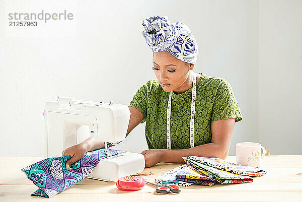 Woman Concentrating on sowing fabric