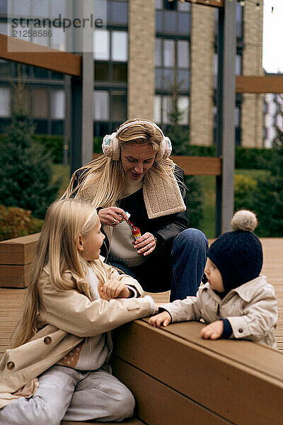 Mom spends time with children in the park