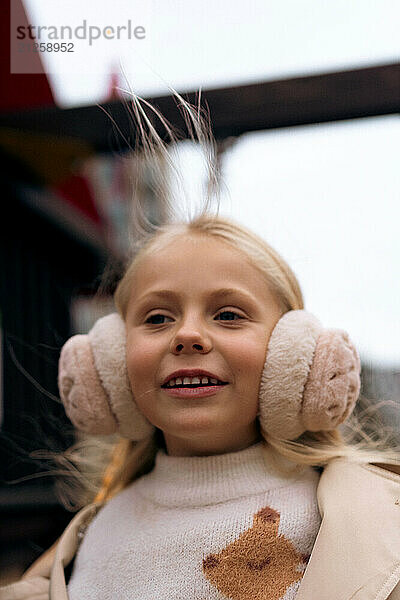 Girl playing on swing at the playground