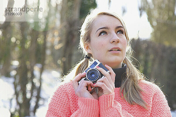 Teenage Girl Holding Camera