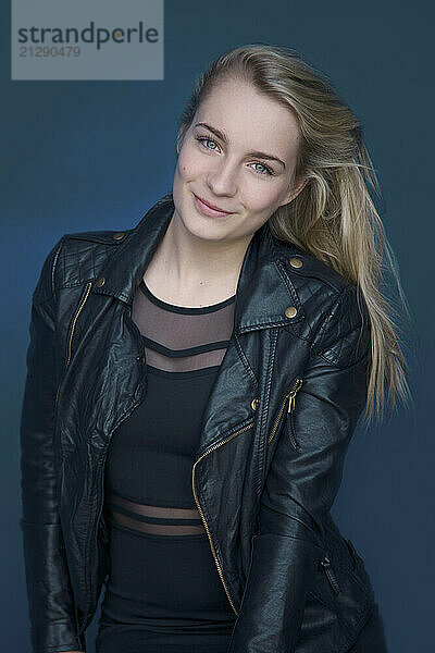 Young Woman in Black Leather Jacket Smiling