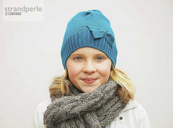 Portrait of Young Girl Wearing Wool Hat and Scarf