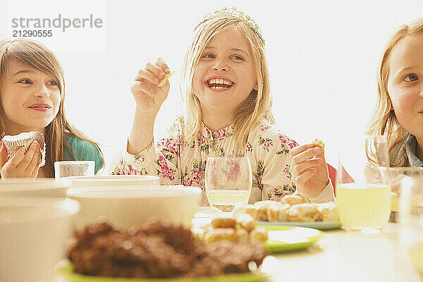 Smiling Girls Eating and Drinking