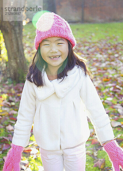 Smiling Young Girl In Park