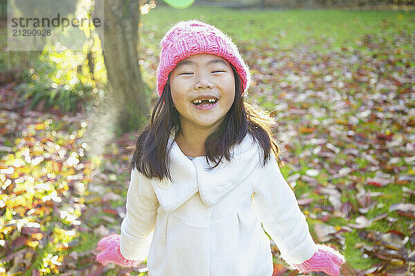 Smiling Young Girl In Park