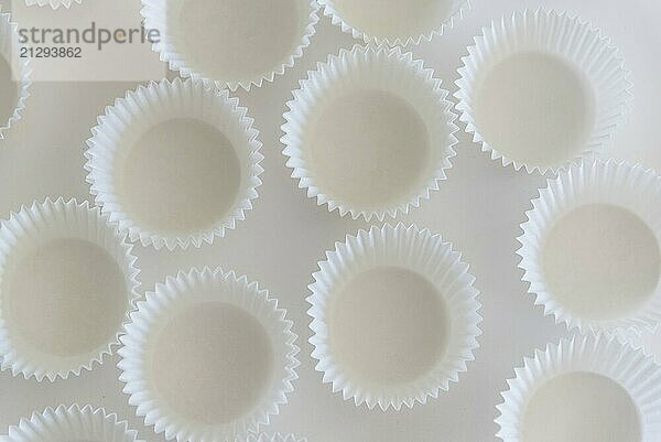 Paper muffin cups isolated on white background. Top view