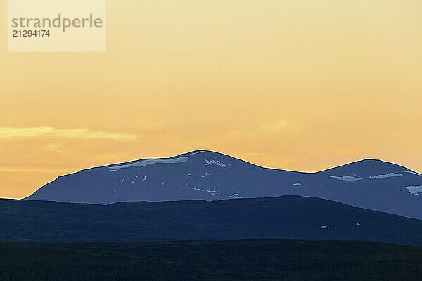 Mountain silhouettes at sunset