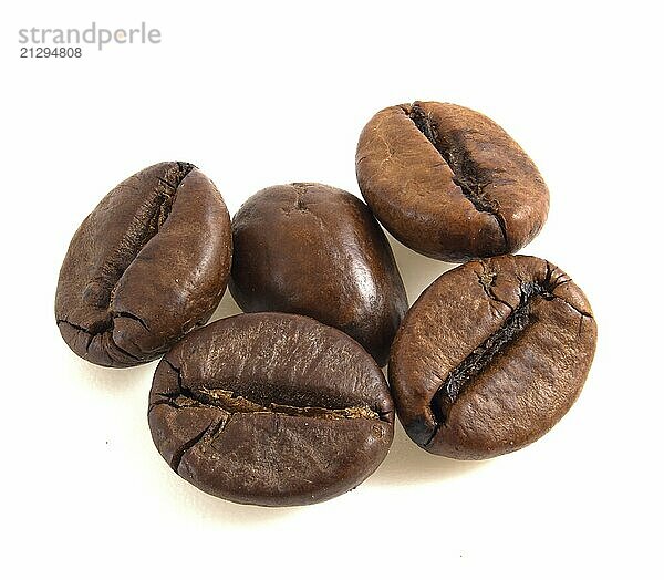 Arabica coffee beans close up isolated on white background