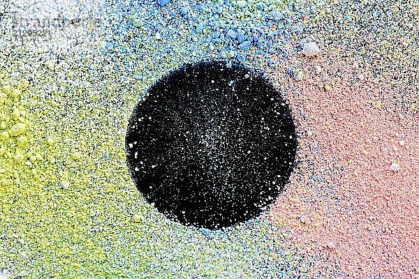 Colorful background of chalk powder. Multicolored dust particles splattered on black background