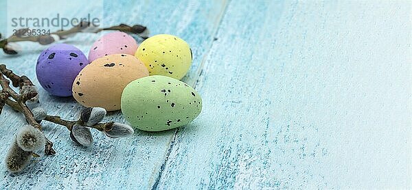 Happy Easter. Easter eggs. Willow twigs. Holy Easter. Blue background