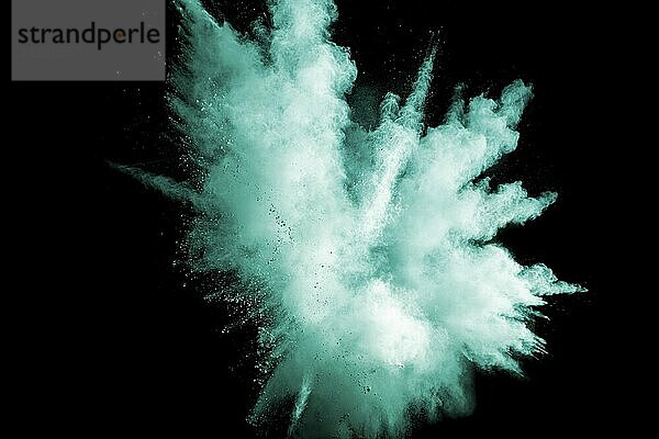 Green color powder explosion cloud on white background. Green dust splash on background