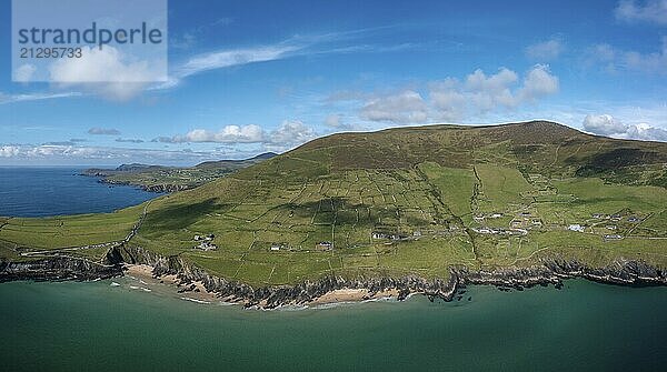 Landscape view of the turquoise waters and golden sand beach at Slea Head on the Dingle Peninsula of County Kerry in western Ireland