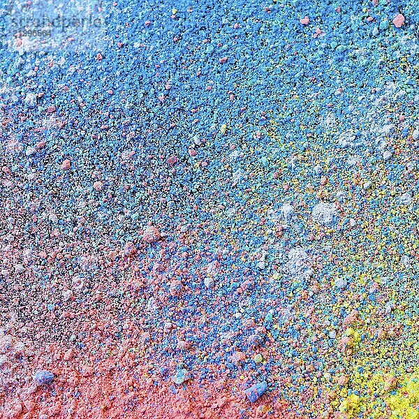 Colorful background of chalk powder. Multicolored dust particles splattered on black background