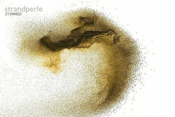 Golden sand explosion isolated on white background.Brown dust particles splattered