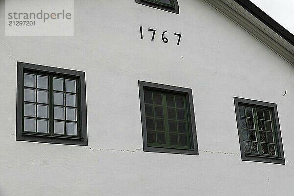 Forsmark  Osthammar Sweden  07 31 2019- facade and wooden windows of a typical dwelling og the 18th century