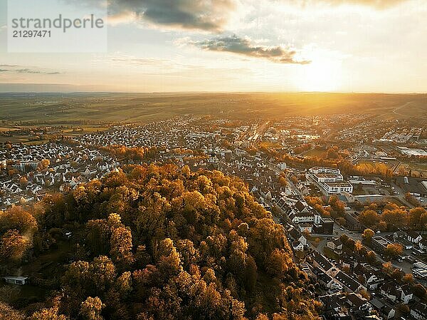 View of a town and surrounding forests at sunset  golden autumn colours  Herrenberg  Germany  Europe