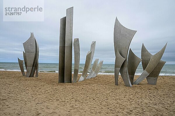 Les Braves  a striking monument on Omaha Beach  honors D-Day's heroes with three elements: Hope  Freedom  and Fraternity. It symbolizes the enduring spirit of unity  courage  and brotherhood from June 6  1944