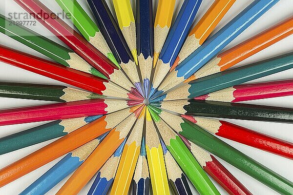 Abstract composition of complementary cirkel with color pencils against a white background