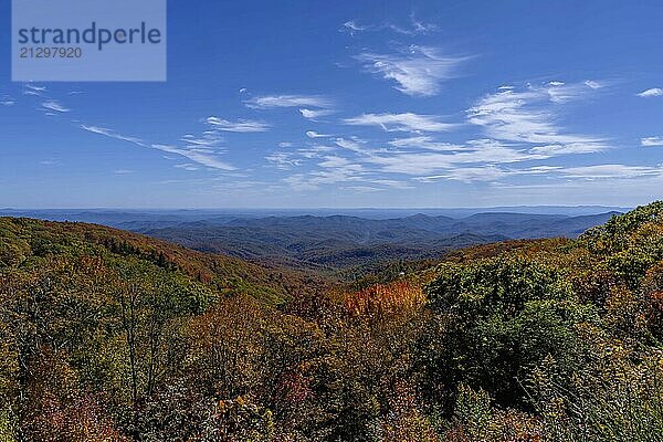 Aerial view of beautiful rock formations along the North Carolina mountains as the leaves start to change during the first part of fall