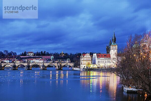 Fantastic view of the Charles Bridge and the Vltava River and the Church of St. Salvator of the zech capital  Prague at blue hour