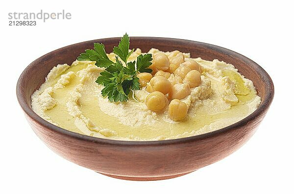 Hummus made of cooked  mashed chickpeas topped with beans and green coriander leaves isolated on white background. Clipping path added