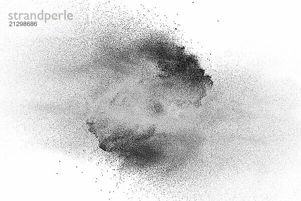 Black powder explosion on white background.Black dust particles splash