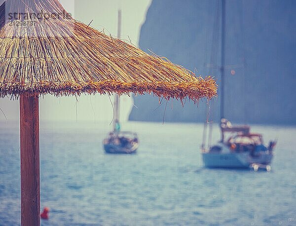 The View From A Mediterranean Beach Bar Of Luxury Yachts In A Beautiful Bay