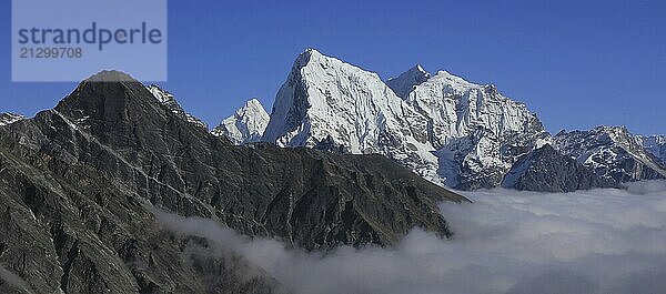 Sea of fog and peaks of Ama Dablam  Cholatse and Tobuche