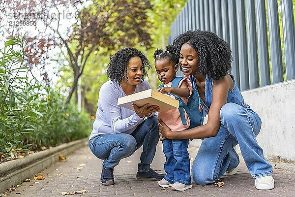 African female family of two generations having fun at the end of a school day