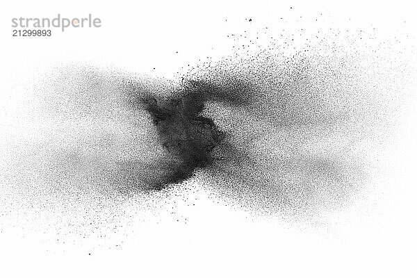 Black powder explosion on white background.Black dust particles splash