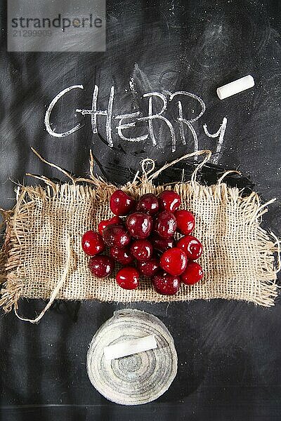 Presentation of a group of cherries on a black background