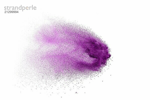 Purple color powder explosion cloud on white background.Closeup of purple dust particles splash on background