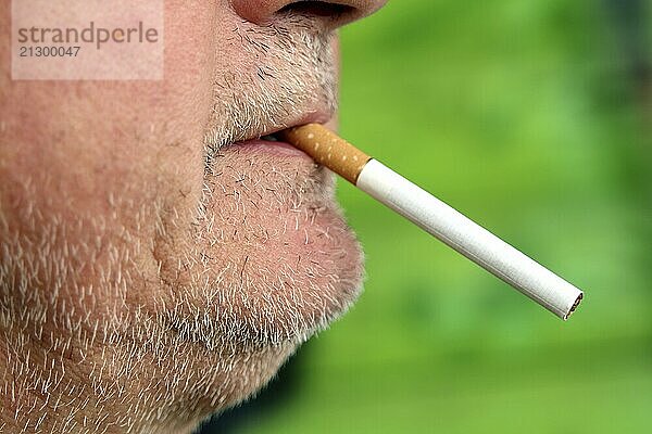 Man with a cigarette in his mouth