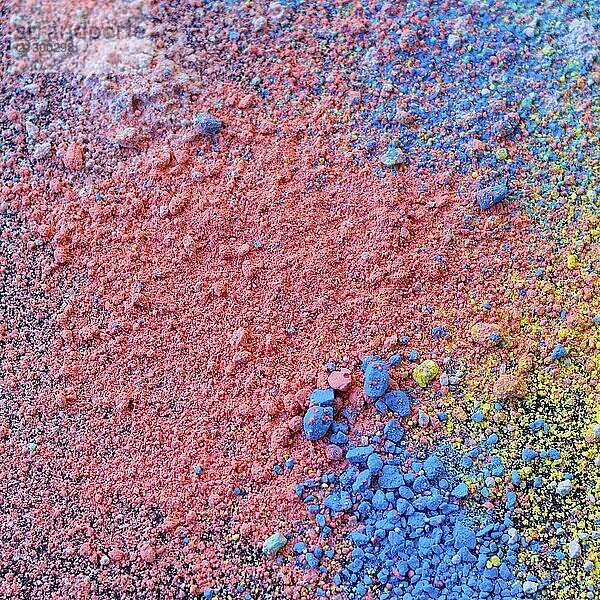 Colorful background of chalk powder. Multicolored dust particles splattered on black background