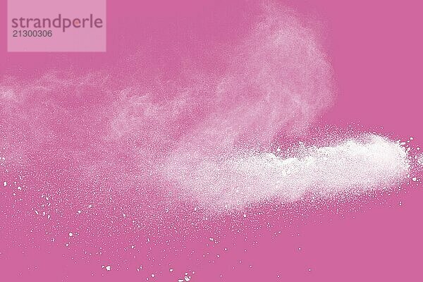 White powder explosion on pink background