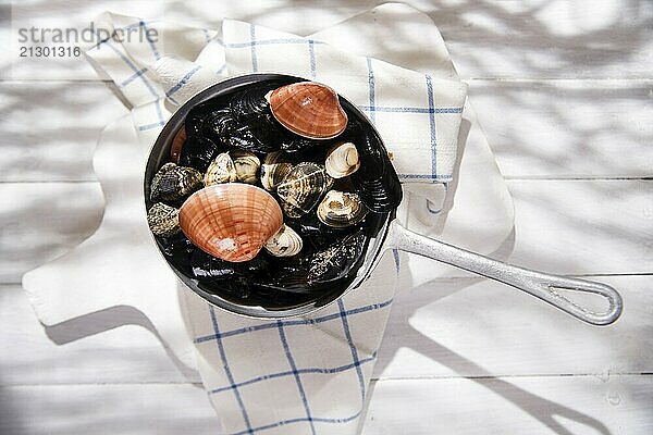 Necessary ingredients for a soup with seafood on a white background