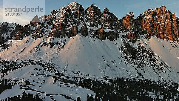 Aerial view of amazing rocky mountains in snow at sunrise  Dolomites  Italy  Europe