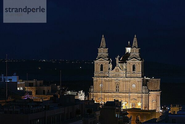 Mellieha  Malta  01 07 2022: The cathedral twin towers and the valley by night  high angle view  Europe