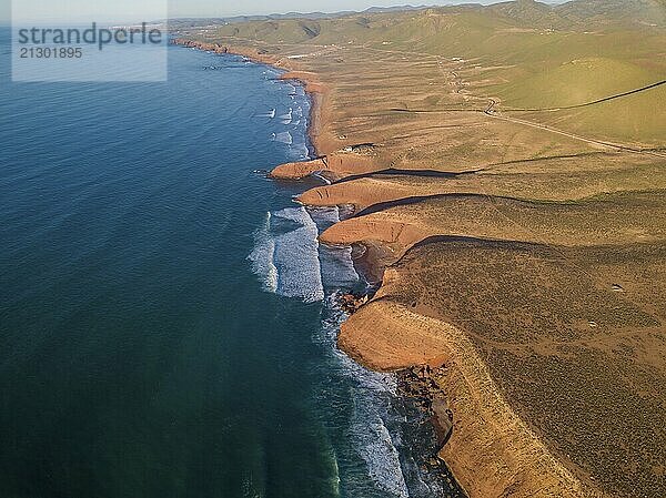 Aerial view on Legzira beach with arched rocks on the Atlantic coast at sunset in Morocco